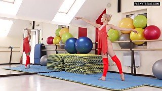 Flexible teen ballerina does splits at rehearsal