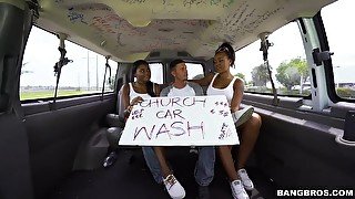 Ebony babes give lucky dude a double blowjob in a moving car