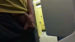 guy pissing at gym toilet