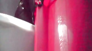 Close distance toilet spy cam of a woman pissing