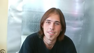 Cute long haired guy grabs his dick and masturbates furiously