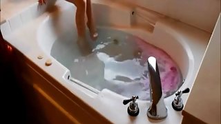 Amazing brunette slut making love in a jacuzzi