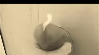 Jerking his big cock through our gloryhole
