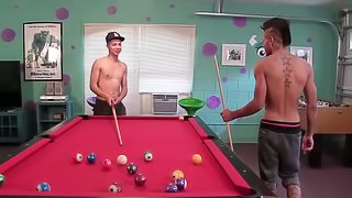 Jorge and Tiger are having a friendly game of billiards in the rec room