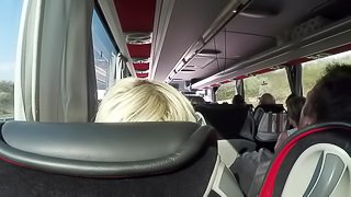 The naked blonde masturbates in a public bus.