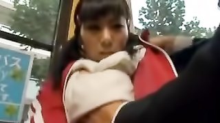 Big tits girl in red gym clothes gets poked in her boobs by a horny guy in the bus.