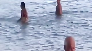 Crazy latin couple fucks in public in the sea with lots of spectators