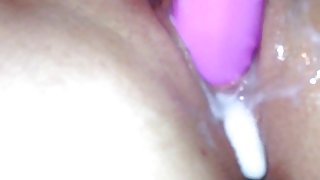 Loud slut with creamy pussy fucking herself and moaning closeup