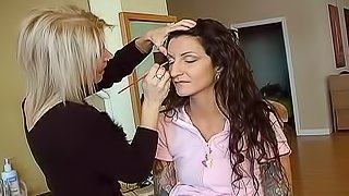 Putting makeup on a young lady