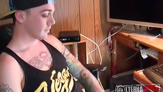 Hot tattooed guy sits at his desk and jerks off for you