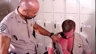 Two cops have gay interracial sex in a locker room