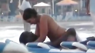 Dirty friendwn skin girl rides her partner in public beach