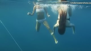 Lustful babes enjoy showing off their bodies underwater