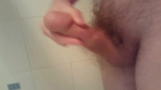 Pulling back skin and playing with thick cock
