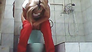 Blonde adorable lady in red panties filmed on hidden cam in the toilet