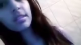 Nasty brunette girl flashes her shaved pussy for the webcam
