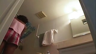 Sexy black girl caught nude in her own bathroom by a spy cam