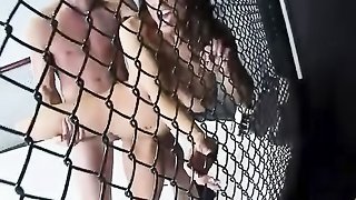 Athletic brunette in purple sports bra and black shorts blows guy and gets her wet cunt ravaged in the cage ring.