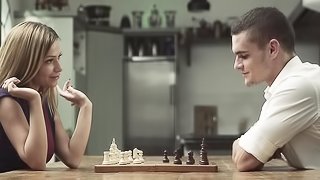 Brunette plays chess with boyfriend and raises sexual tension high.
