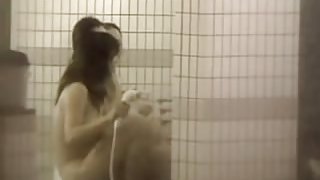 Busty Asian girlfriends spied taking the hot shower