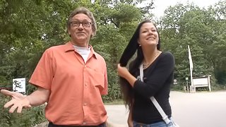 Brunette Sandra gets her pussy fingered outdoors by a horny old man