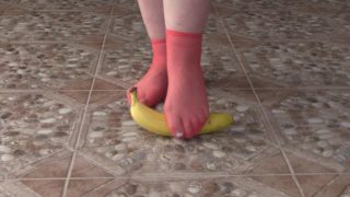 Fat legs in socks ruthlessly trample banana. Crush Fetish, foot fetish.