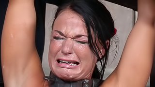Black-haired cutie almost cries during the painful bondage treatment