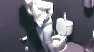 Blonde in high heels and lingerie rubs pussy in toilet voyeur