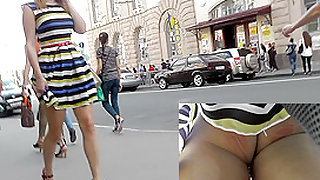 Real upskirt view of a raven-haired young girl in thong