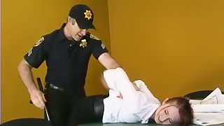 Redhead girl gets tied up and toyed by a police officer