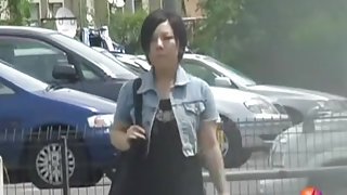 Black-haired petite Asian hoe flashes her bushy pussy during street sharking