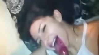 Attractive Brunette sucks a big dick and gets a facial