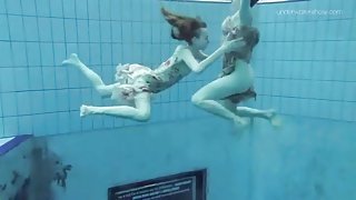 Teens jump in the pool in their cute dresses