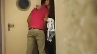 Voyeur tapes a party couple having sex in the hallway of a hotel