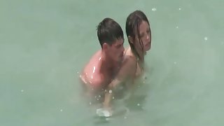 Naked couples caught fucking in the ocean