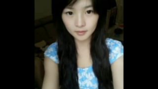 Cute chinese girl playing on webcam