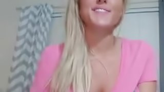 Busty blonde with big round tits teasing and fingering her pink pussy