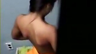 Slim and sexy Indian teen chick got caught changing in the public toilet